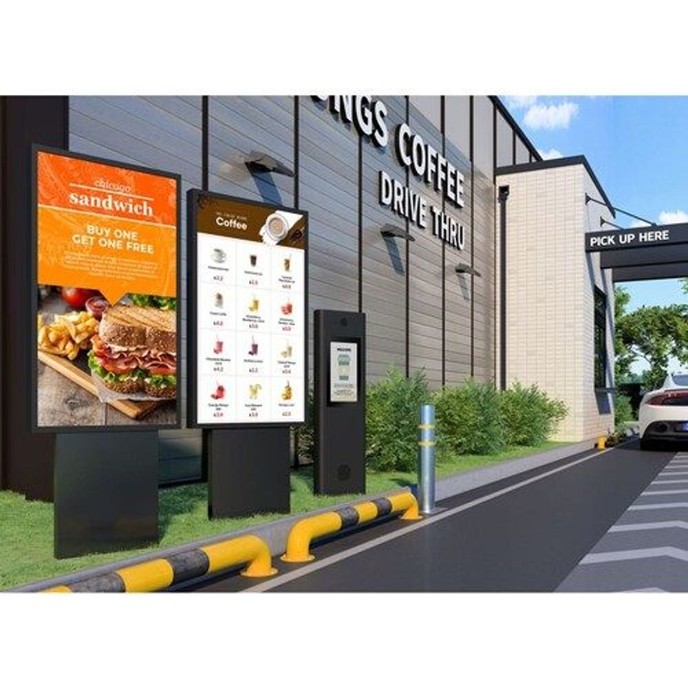 55-inch vertical digital signage display on pedestal stand, showing menu and pickup info