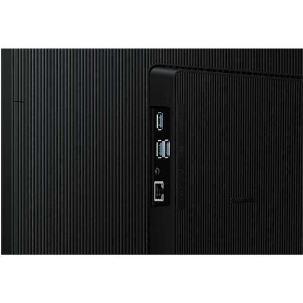 Black monitor rear side showing USB and video input ports near the center.