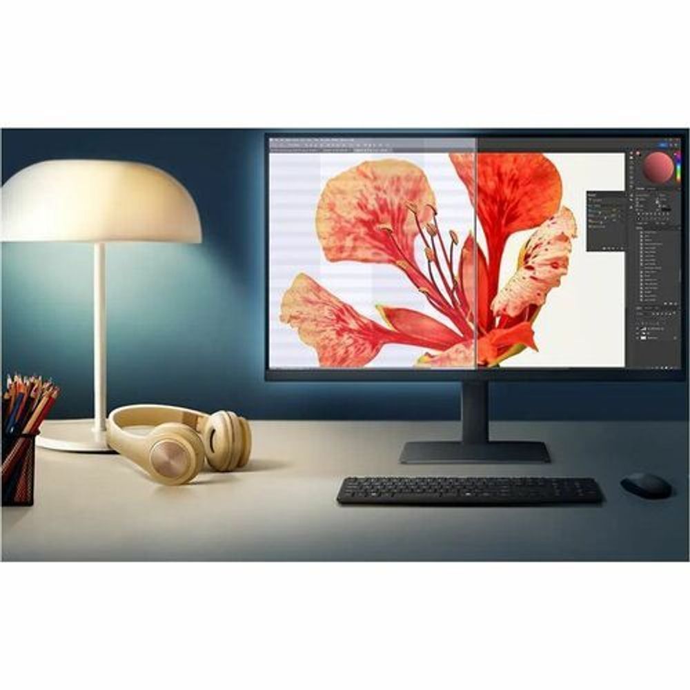 Black computer monitor with slim stand displaying a colorful desktop image
