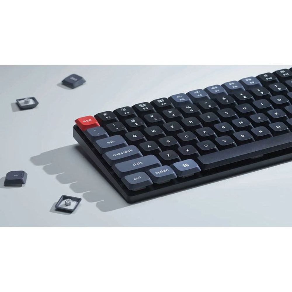 Wireless mechanical keyboard with black keys and brown switch caps, low-profile design