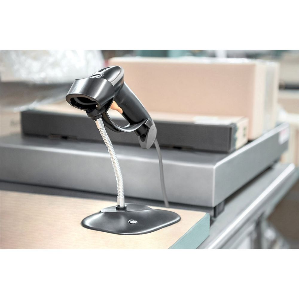 Handheld USB barcode scanner on a desktop stand with cable