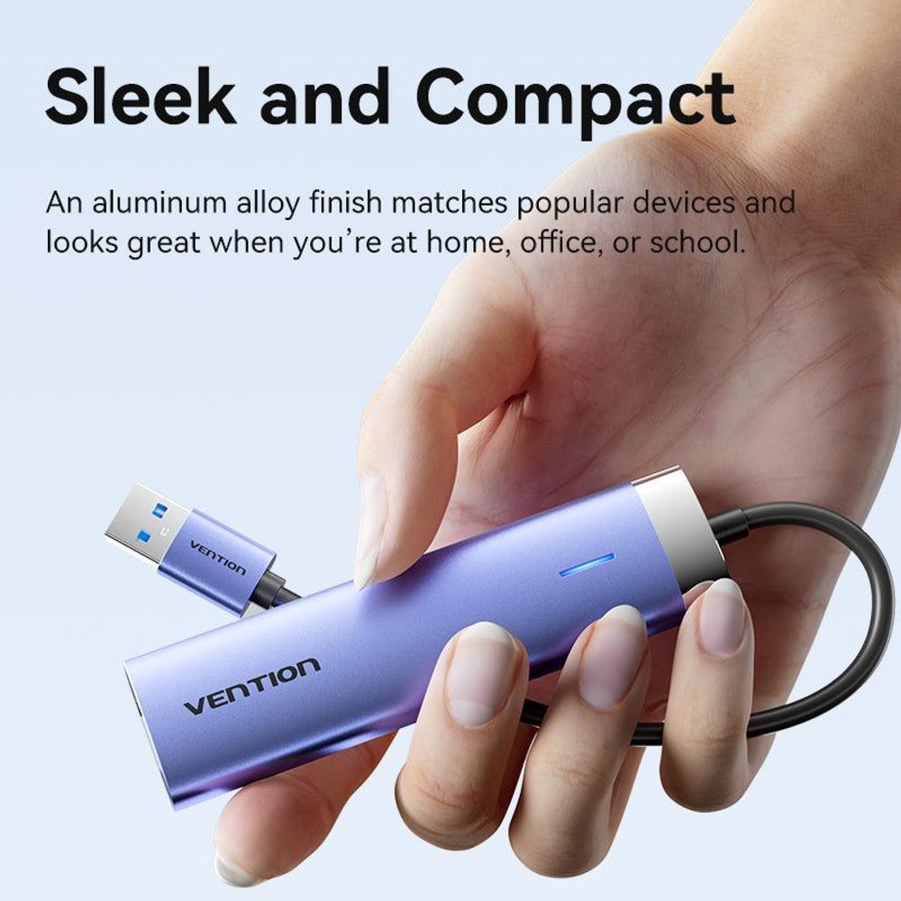 Blue aluminum USB hub with built-in Ethernet and USB-A connector, held in hand