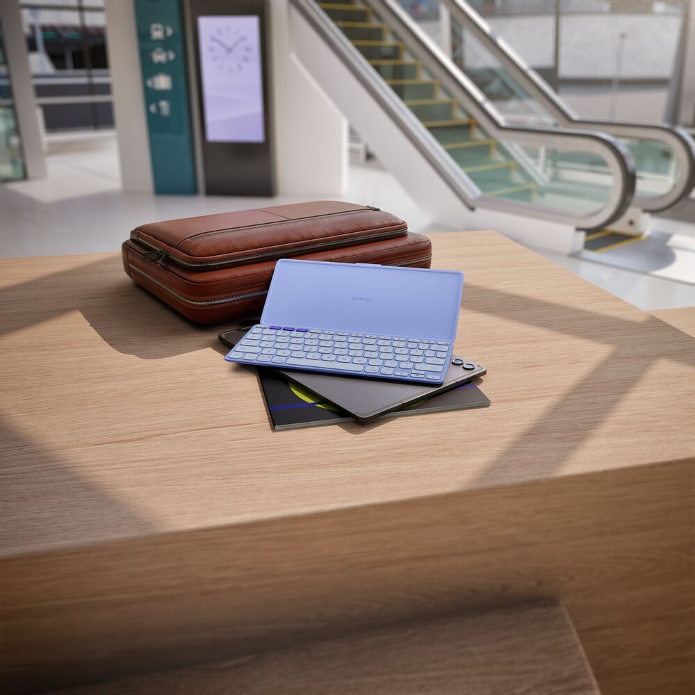 Lilac portable wireless keyboard with foldable protective cover