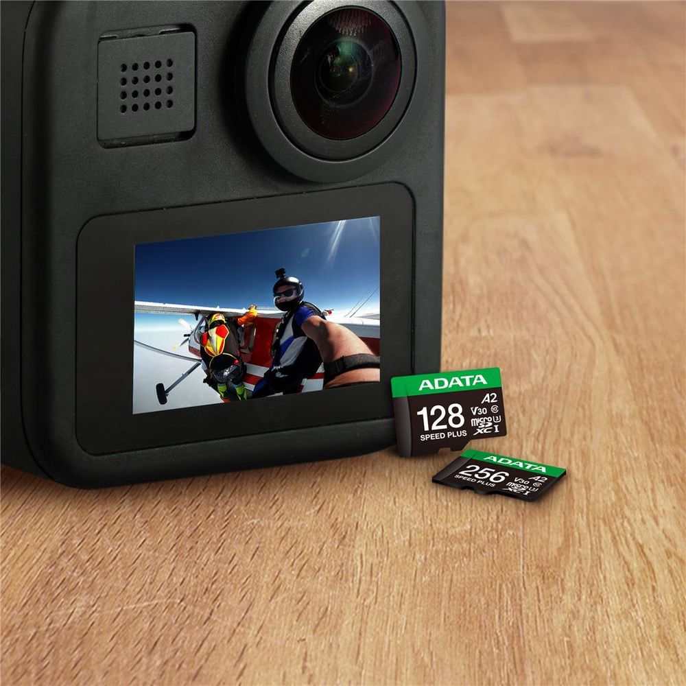 dashcam with microSD card and adapter accessory beside it