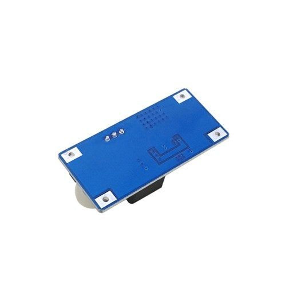 Blue regulator module back PCB with four mounting holes and printed components