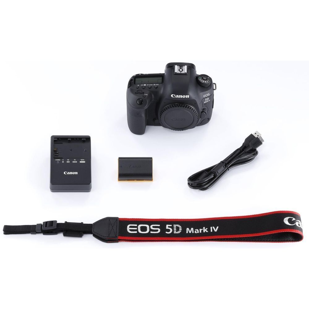 Black Canon EOS 5D Mark IV DSLR camera body with strap, battery, and cable