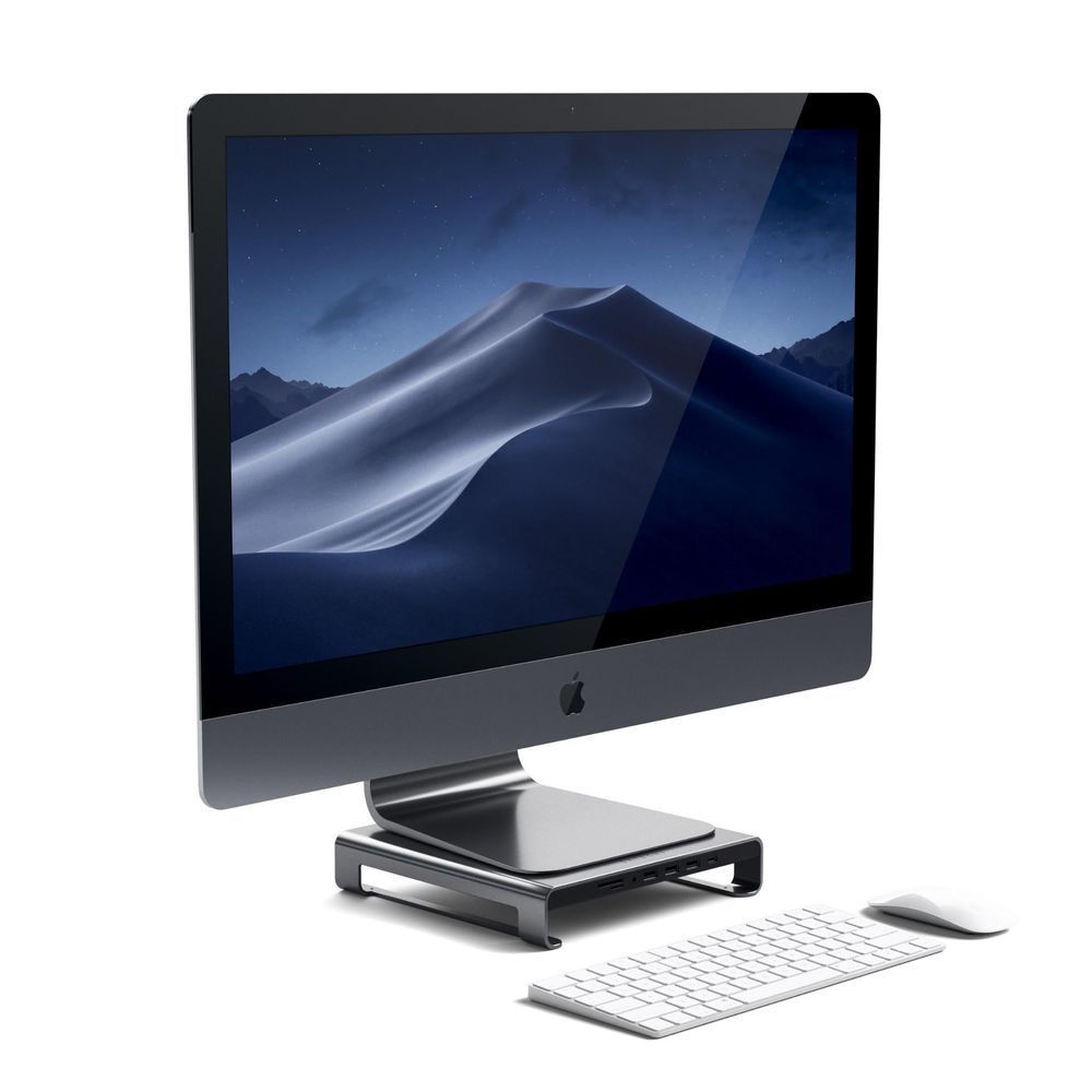 Monitor stand hub holding iMac, space gray base raised with front ports