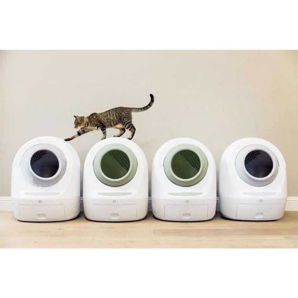 Set of four white covered pet litter boxes with dark circular entrances