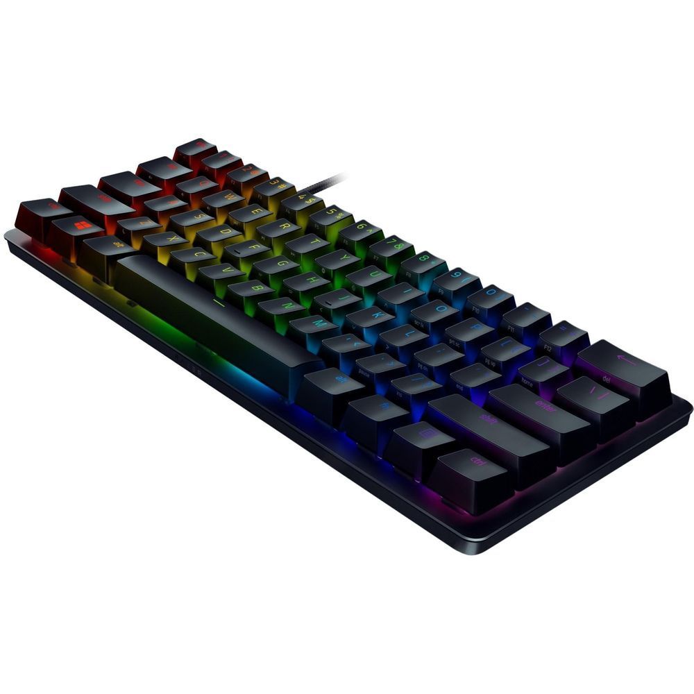 Compact RGB gaming keyboard with rainbow-lit keys on dark frame, angled