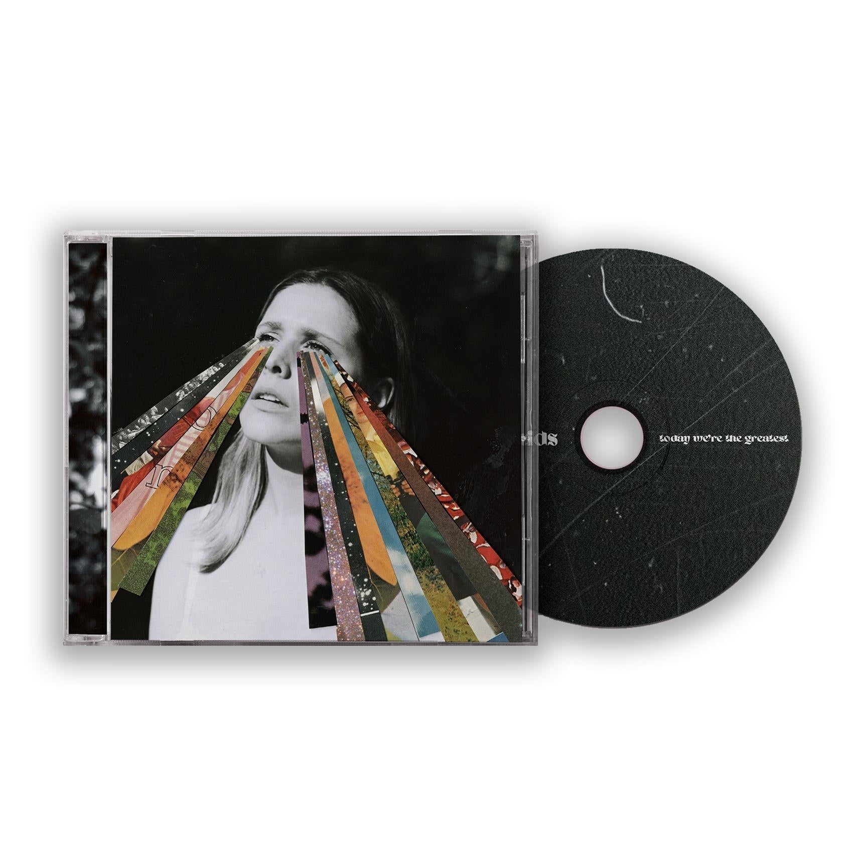 CD album with portrait cover featuring multicolor ribbon stripes and a black disc