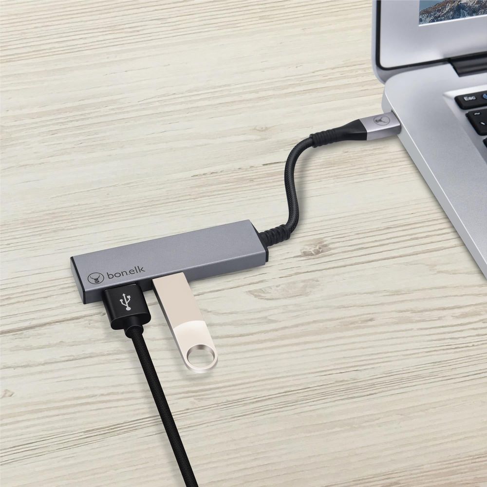 Slim USB-C hub adapter with two USB-A ports, connected to a laptop