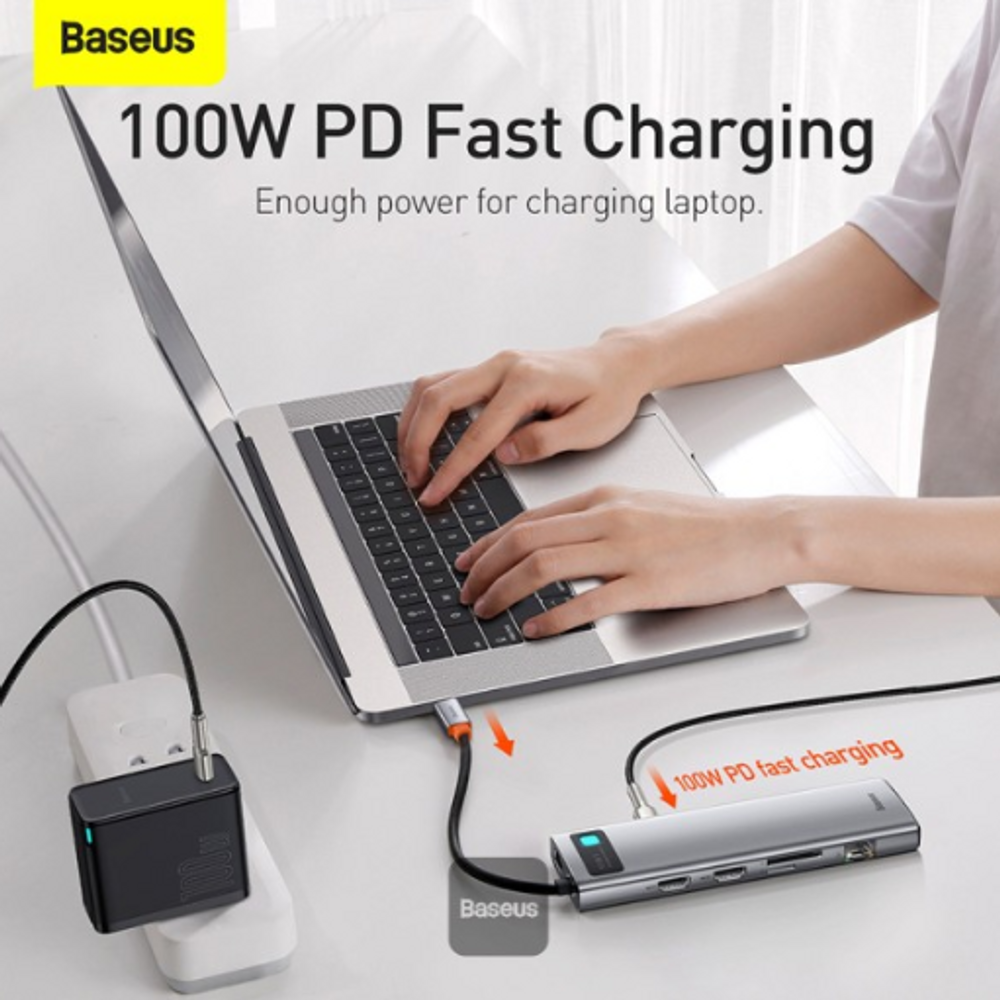 Space gray USB-C docking hub with 100W PD charging connection and indicator light