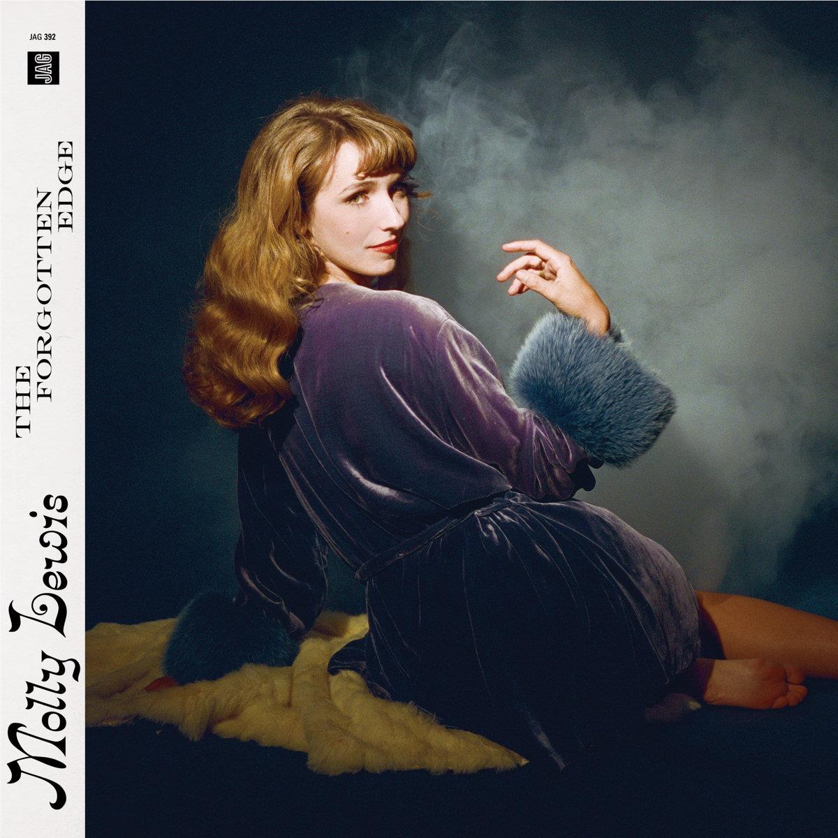 Moody printed book cover featuring a woman in a dark coat sitting outdoors