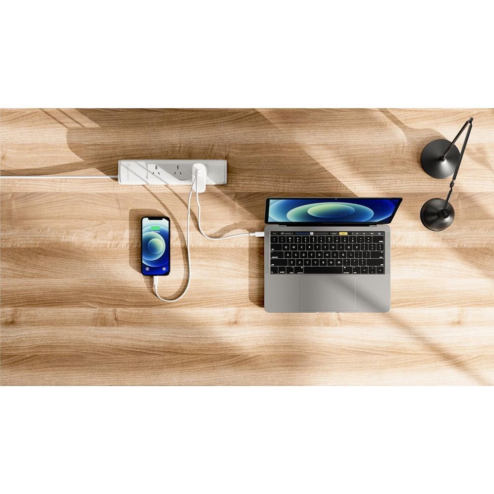 White USB-C wall charger with cable charging a smartphone