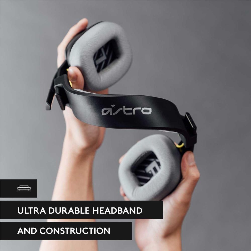 Black over-ear headset with gray ear pads held in both hands