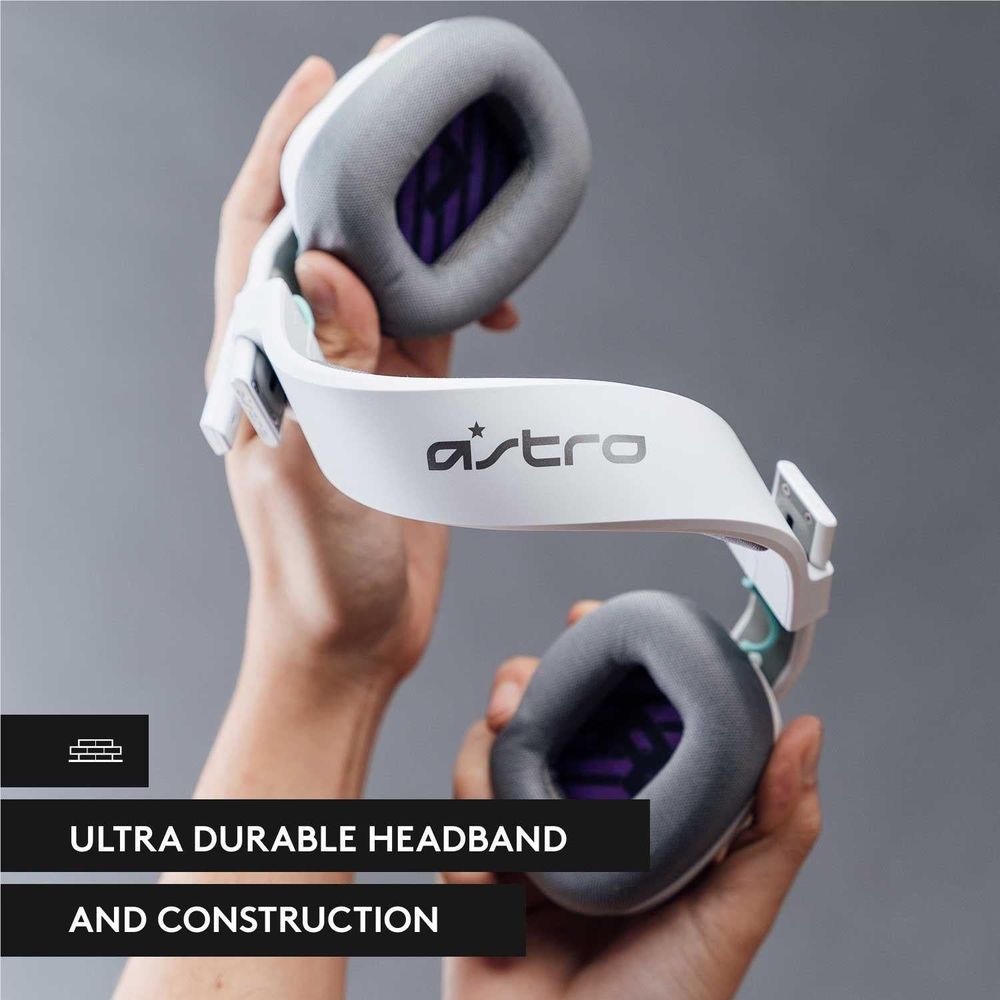 White over-ear headset held in hands with gray ear cushions and durable headband pad