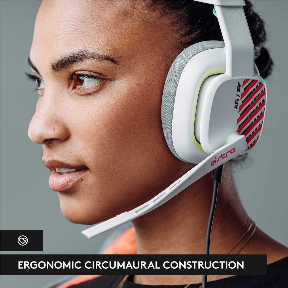 Close-up of white over-ear headset on ear with gray cushions and red logo side panel