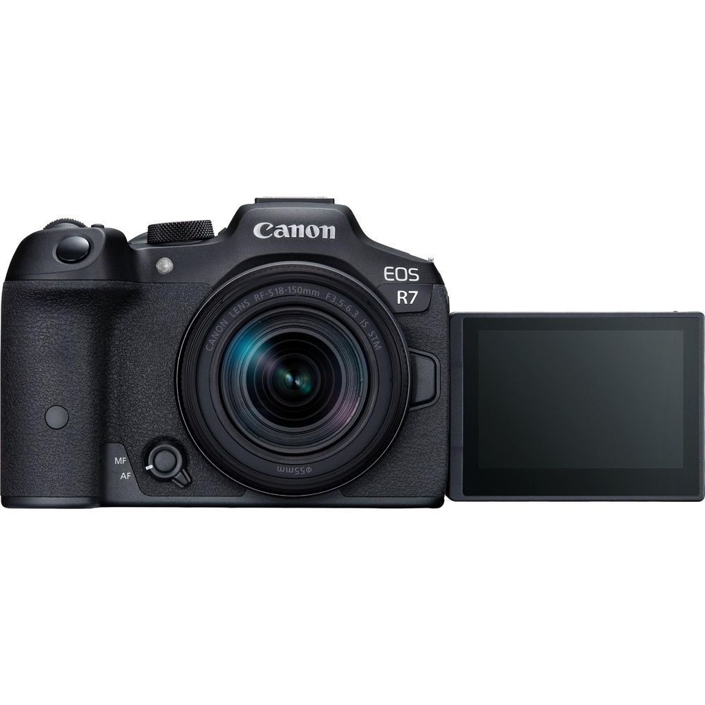 Canon EOS R7 mirrorless camera with 18-150mm lens and rear LCD screen, side view