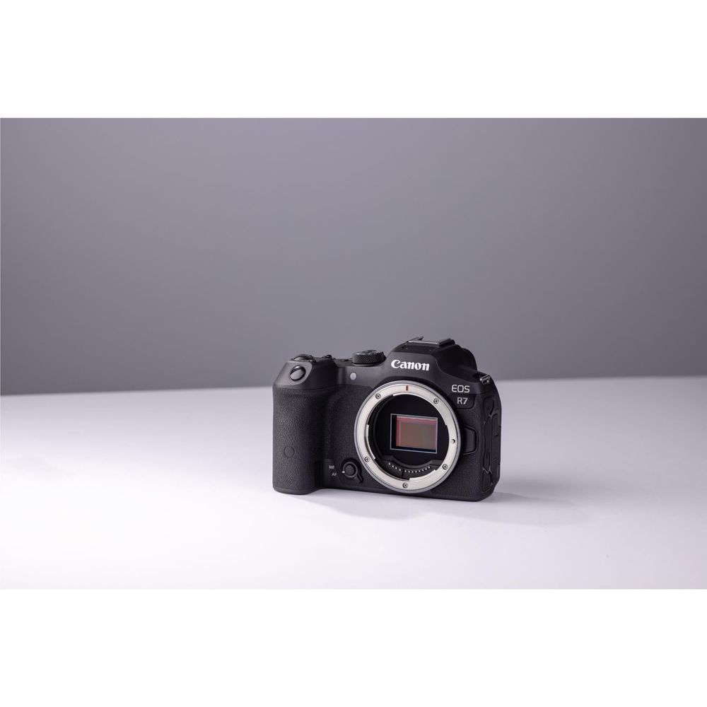 Canon EOS R7 mirrorless camera with exposed sensor mount, front view