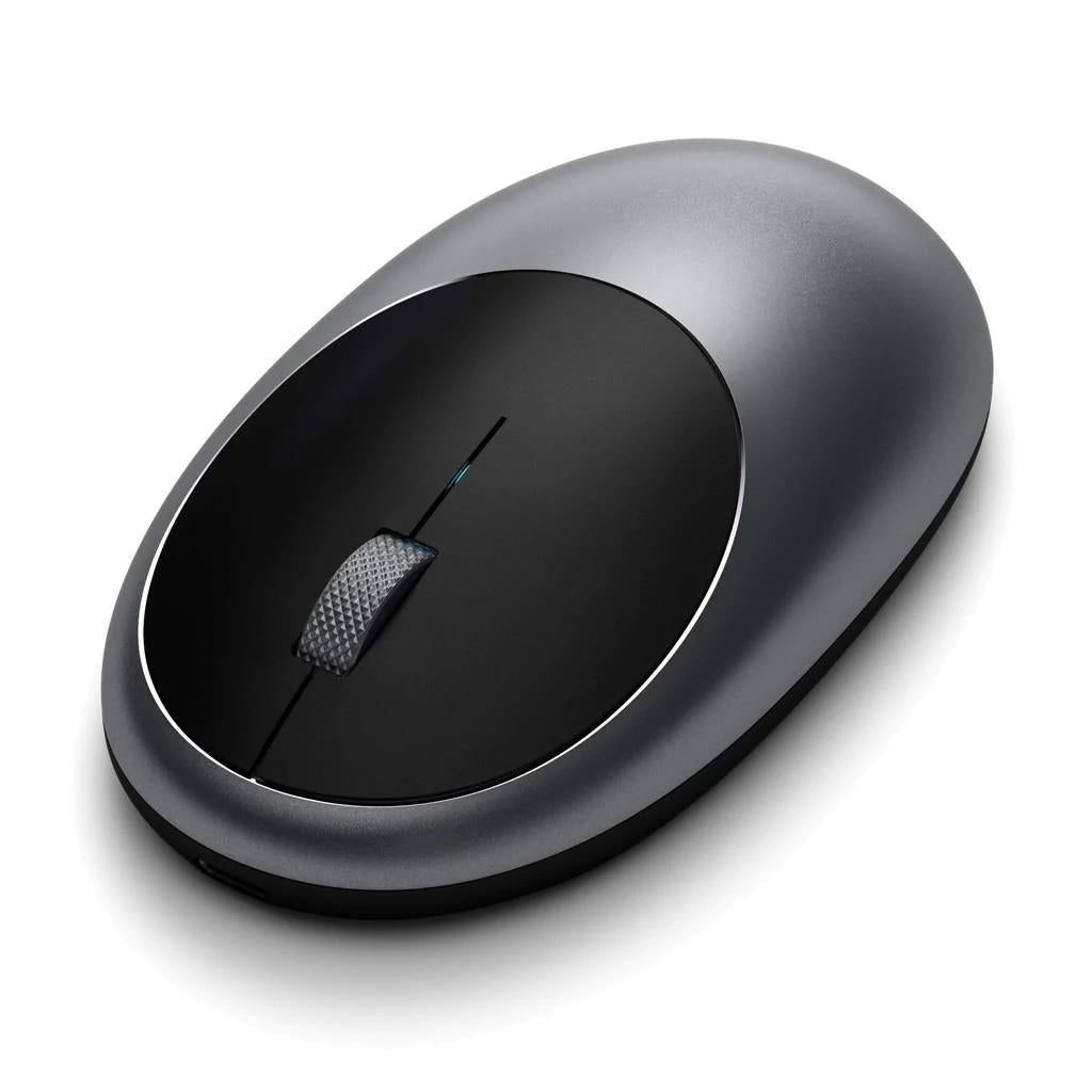 Space grey wireless optical mouse, close top view with textured scroll wheel