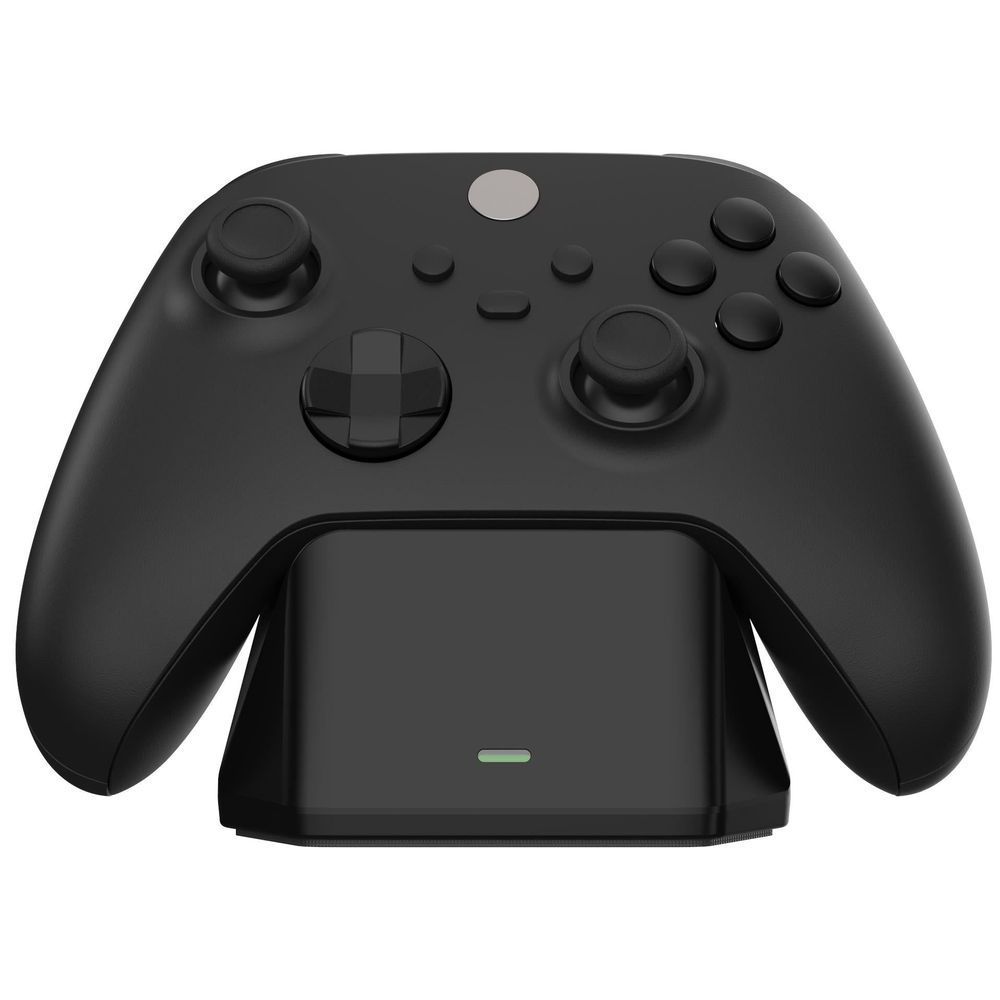 Black charging display stand with controller laid on top of the charging dock