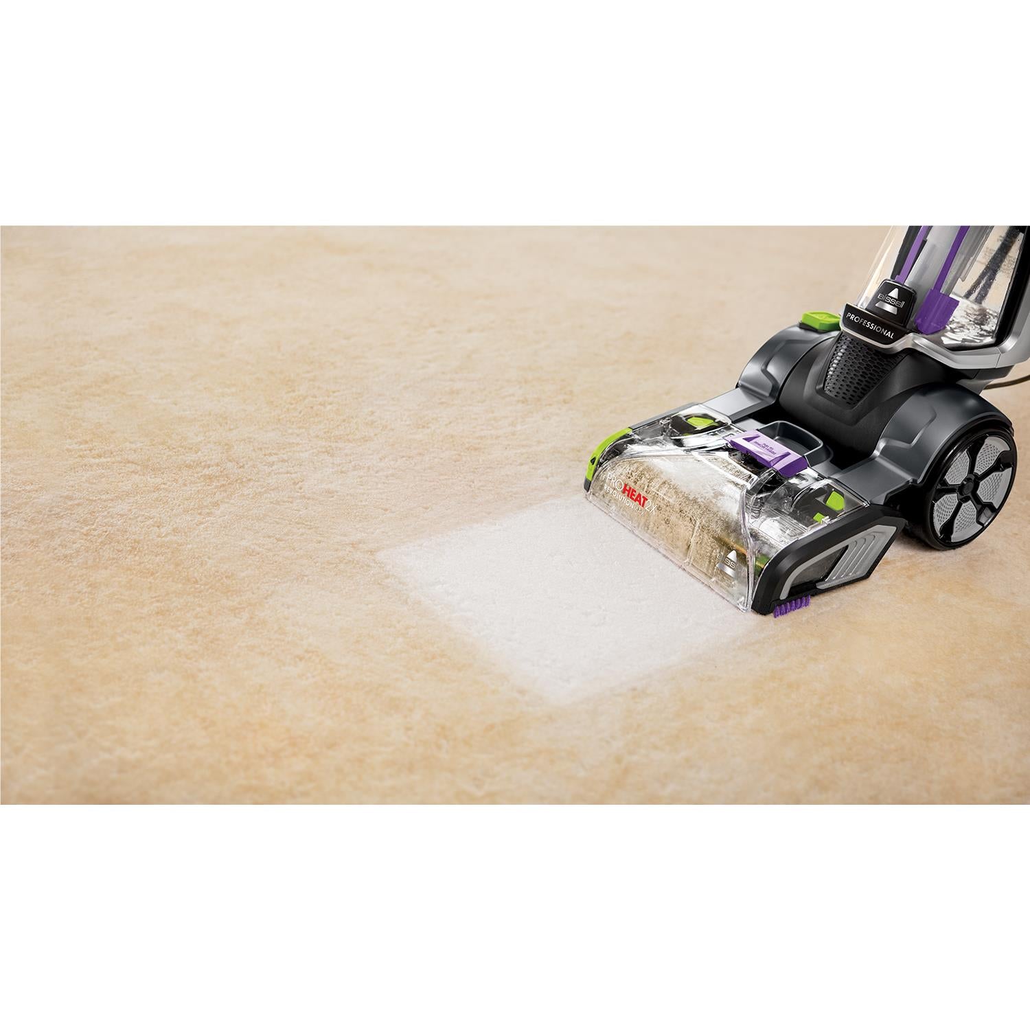 Carpet cleaner nozzle assembly with clear dirt tank and purple accents, black housing