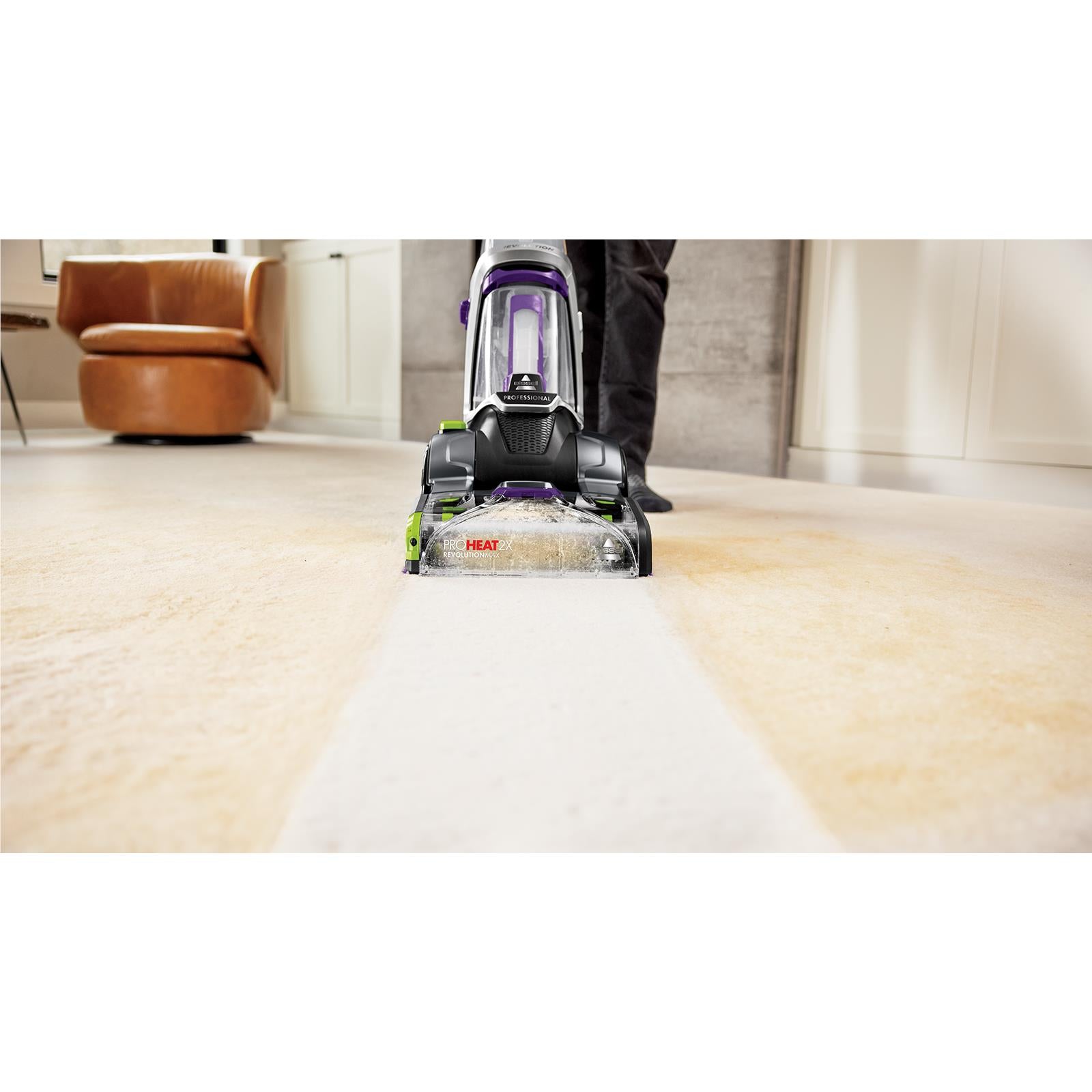 Upright carpet cleaner with front nozzle and clear tank, black and purple