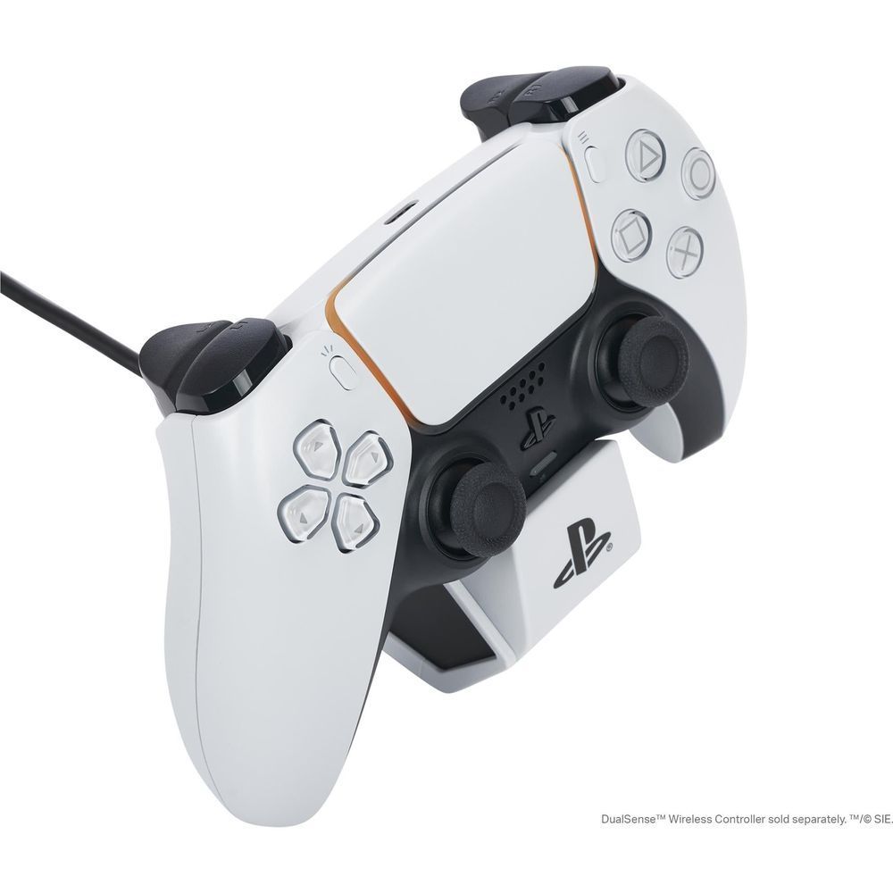 White controller charging dock with controller resting in black cradle, cable attached