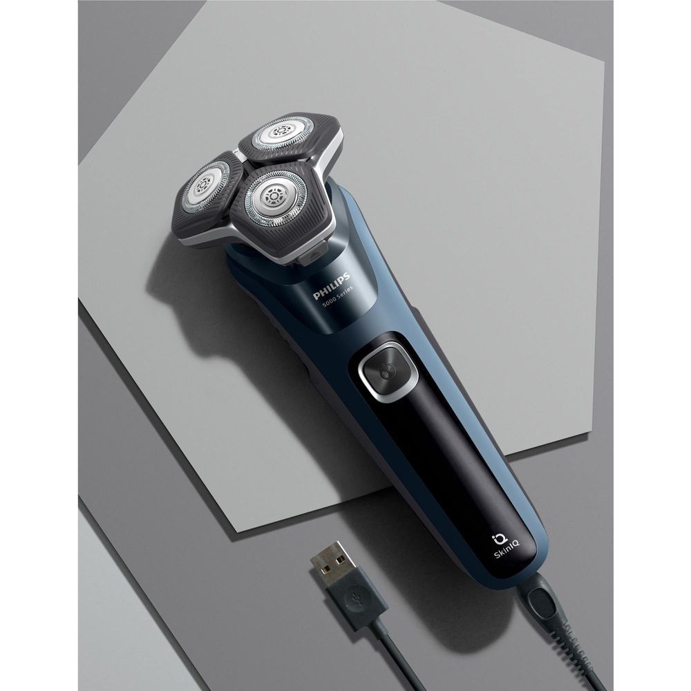 Blue and black electric shaver with USB charging cable