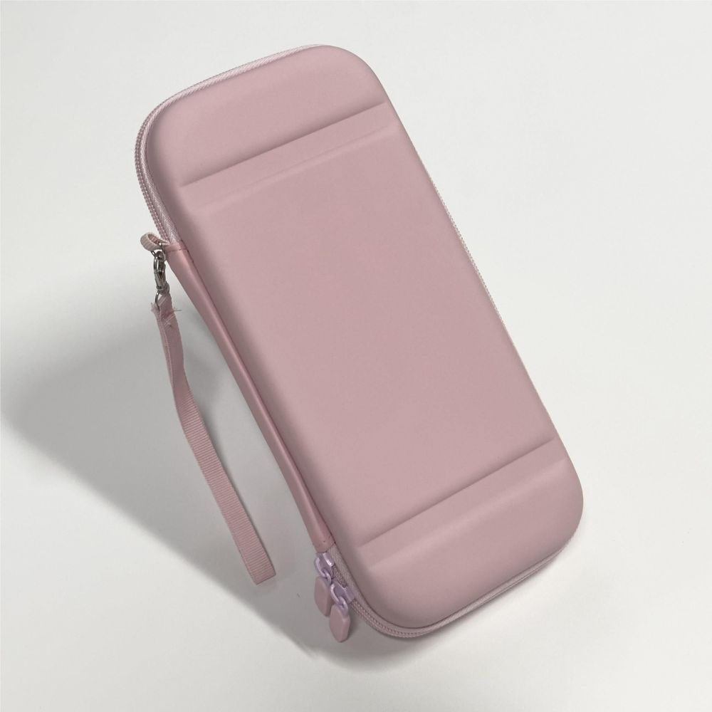 Pink Nintendo Switch case with wrist strap, angled view
