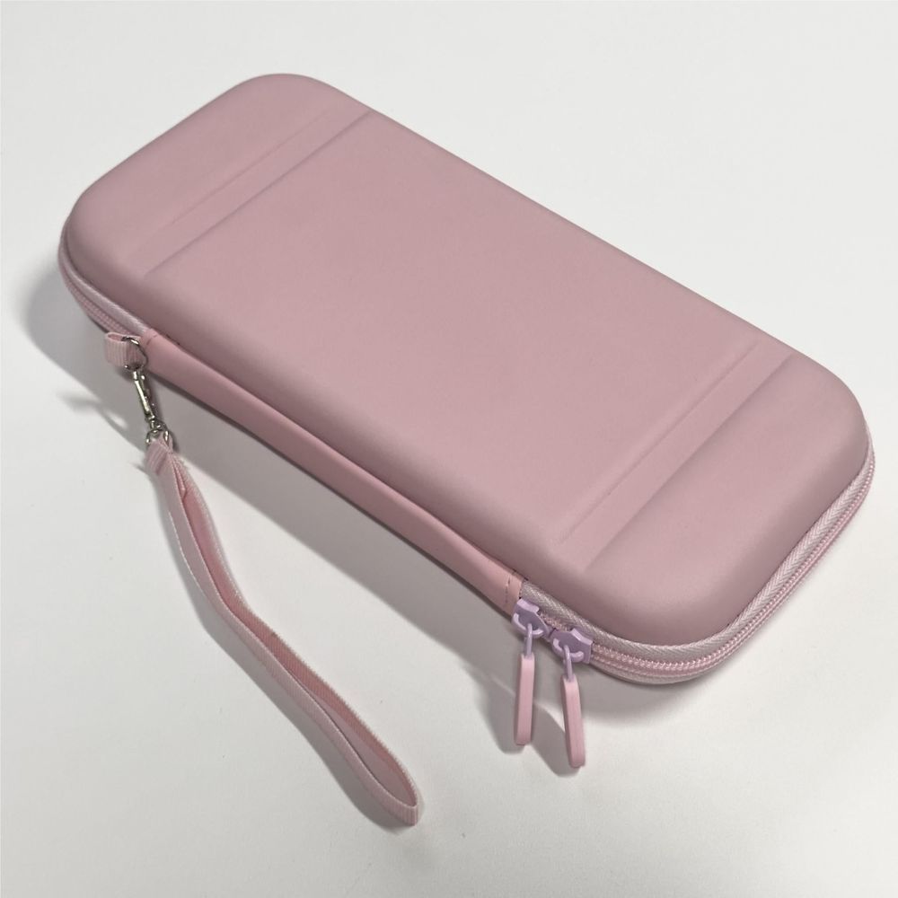 Pink Nintendo Switch case with wrist strap and dual zipper pulls, side view