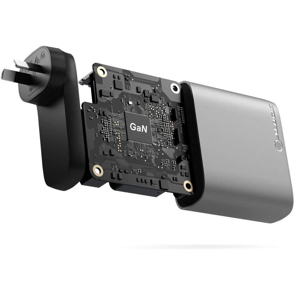 Space grey GaN wall charger with exposed circuit board and port openings