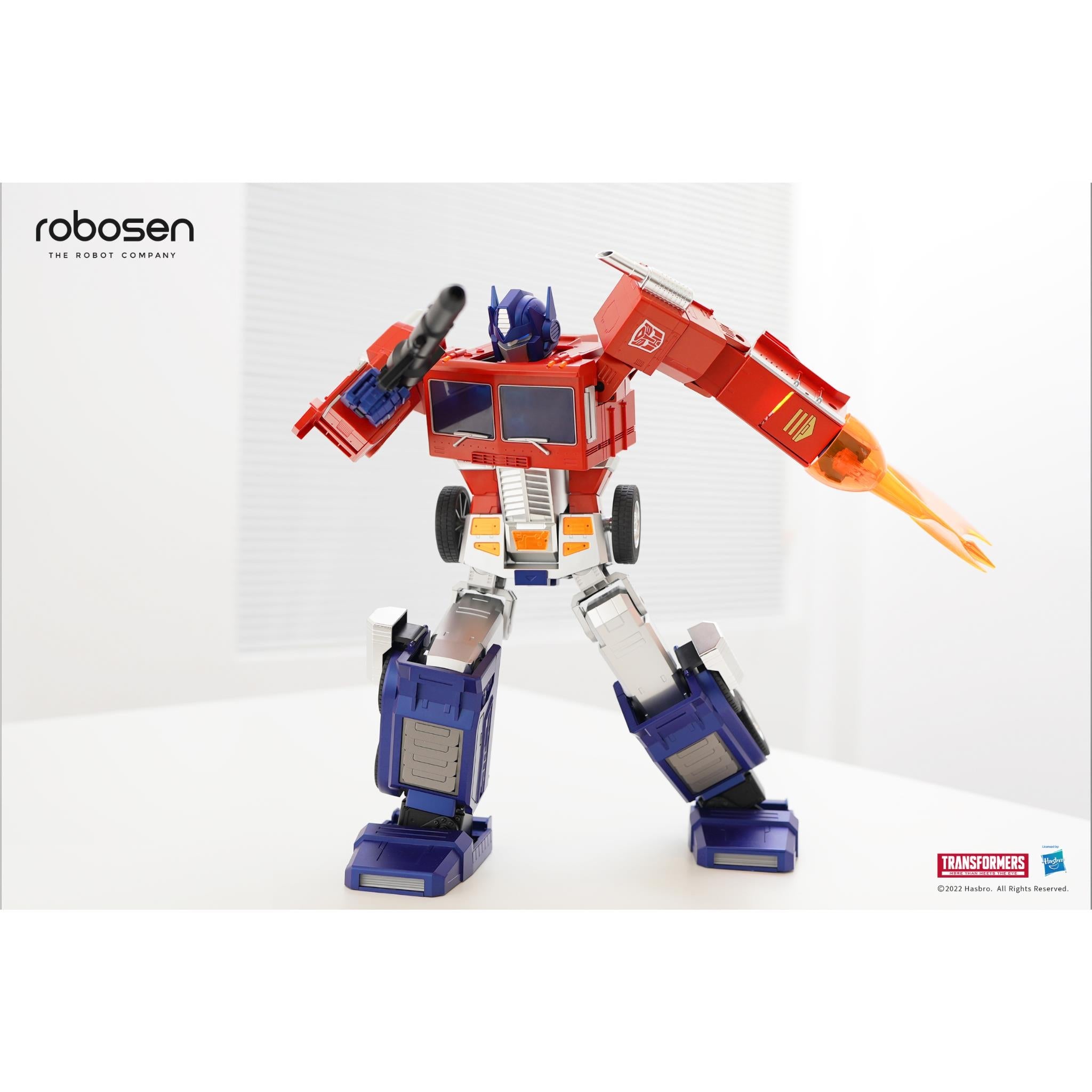 Optimus Prime robot figure with extended orange weapon, red and blue full-body armor