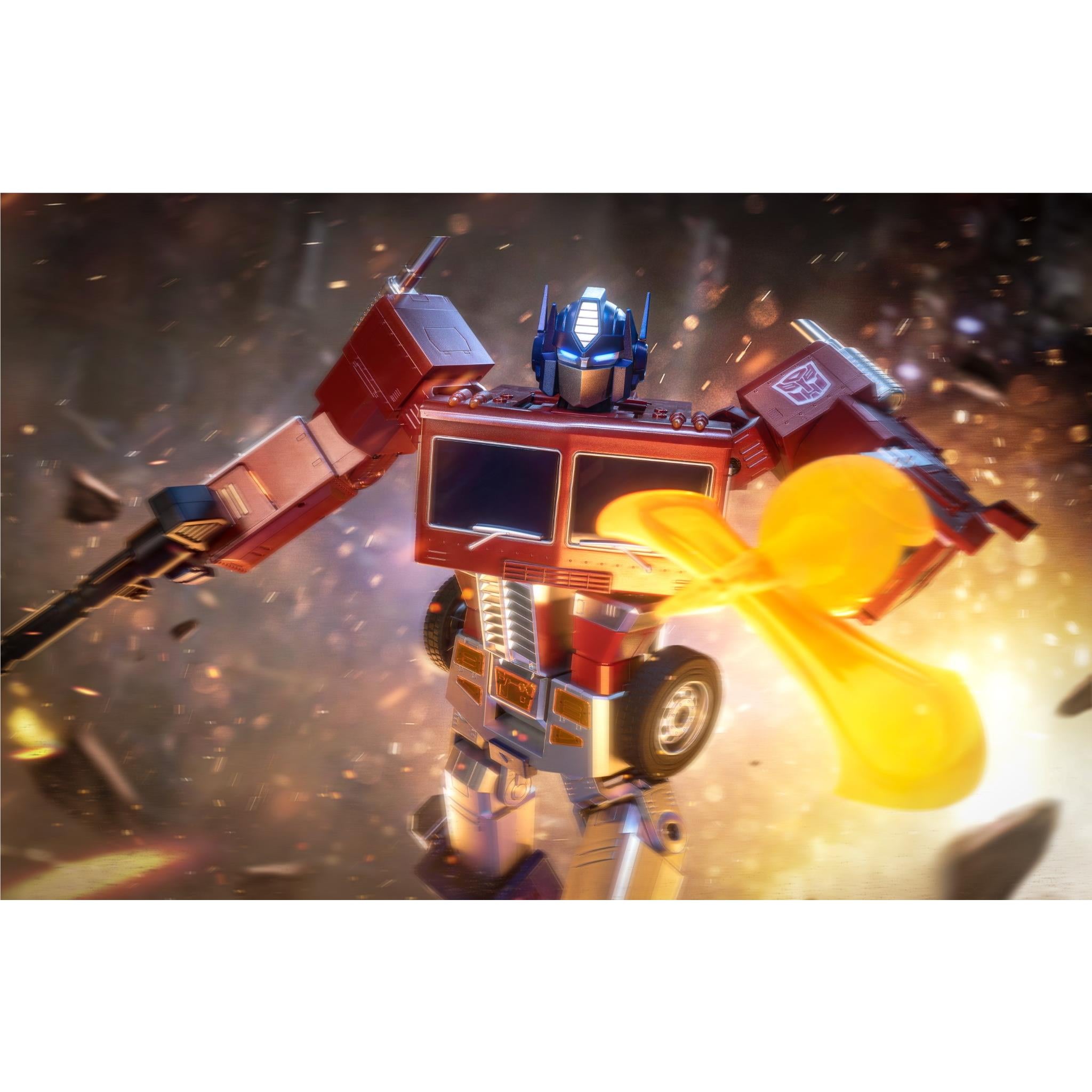 Red and blue transforming robot toy in flying pose with bright orange energy blast