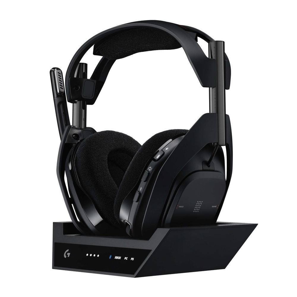 Wireless gaming headset on base station; black foam ear pads and curved headband