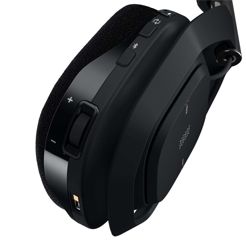 Wireless gaming headset ear cup close-up with +/– buttons, ports, and control slider