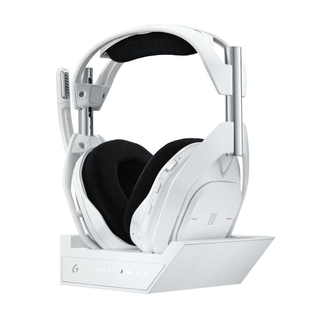 White wireless gaming headset, black ear cushions, resting on white base dock.