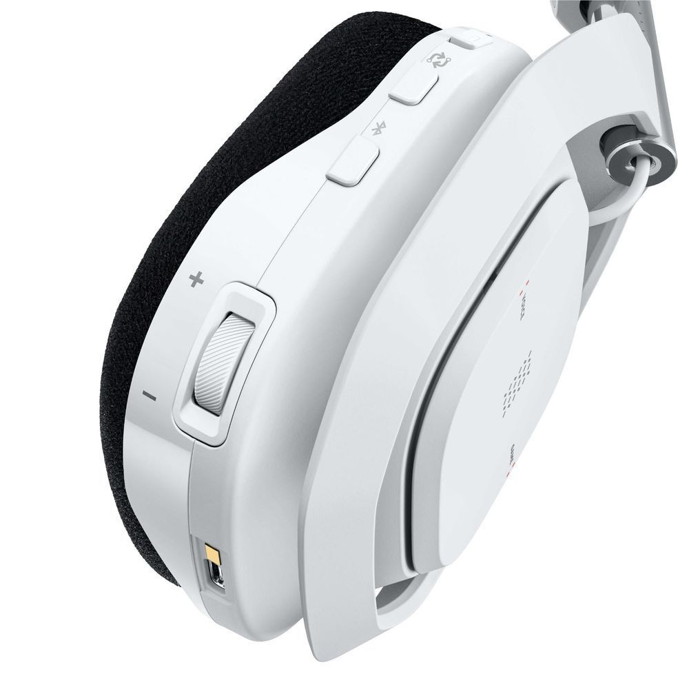 White earcup of wireless gaming headset with black strap and button controls.