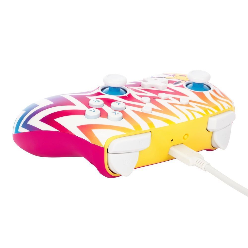 Yellow and pink wireless game controller with zigzag design and connected white charging cable
