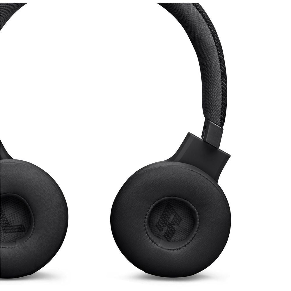 Black JBL on-ear headphones with detailed ear pad and hinge, close-up