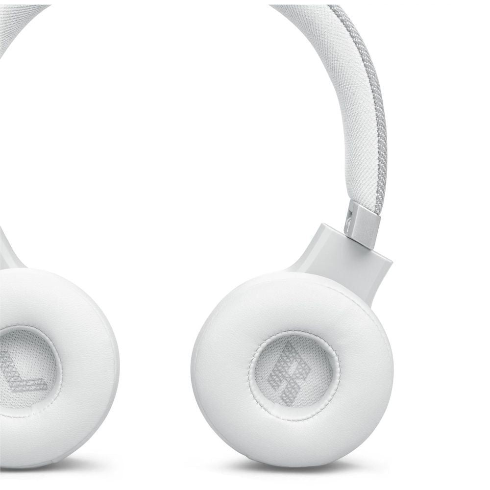 White ear cushions and headband connection with circular mesh speaker openings