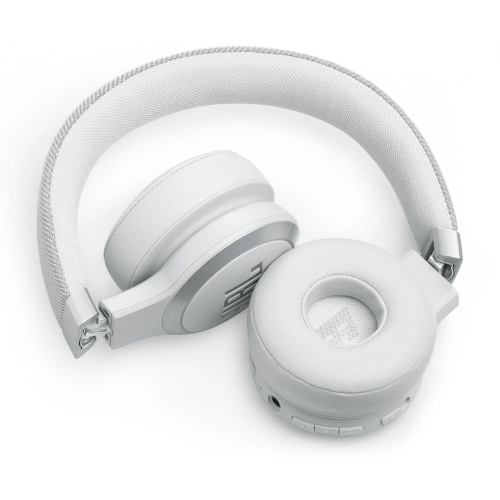 White on-ear wireless headphones with side buttons and headband, ear cups angled