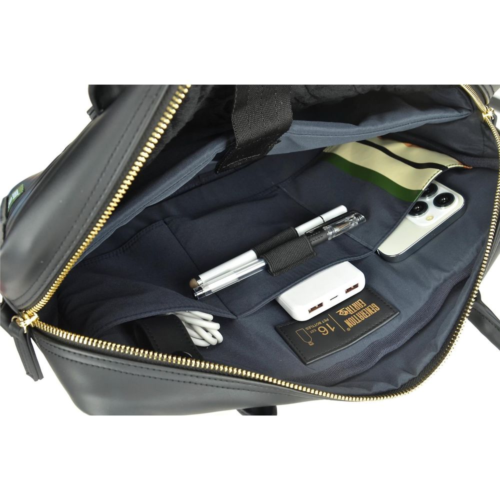 Black briefcase interior with organizer slots and small devices in the main compartment.