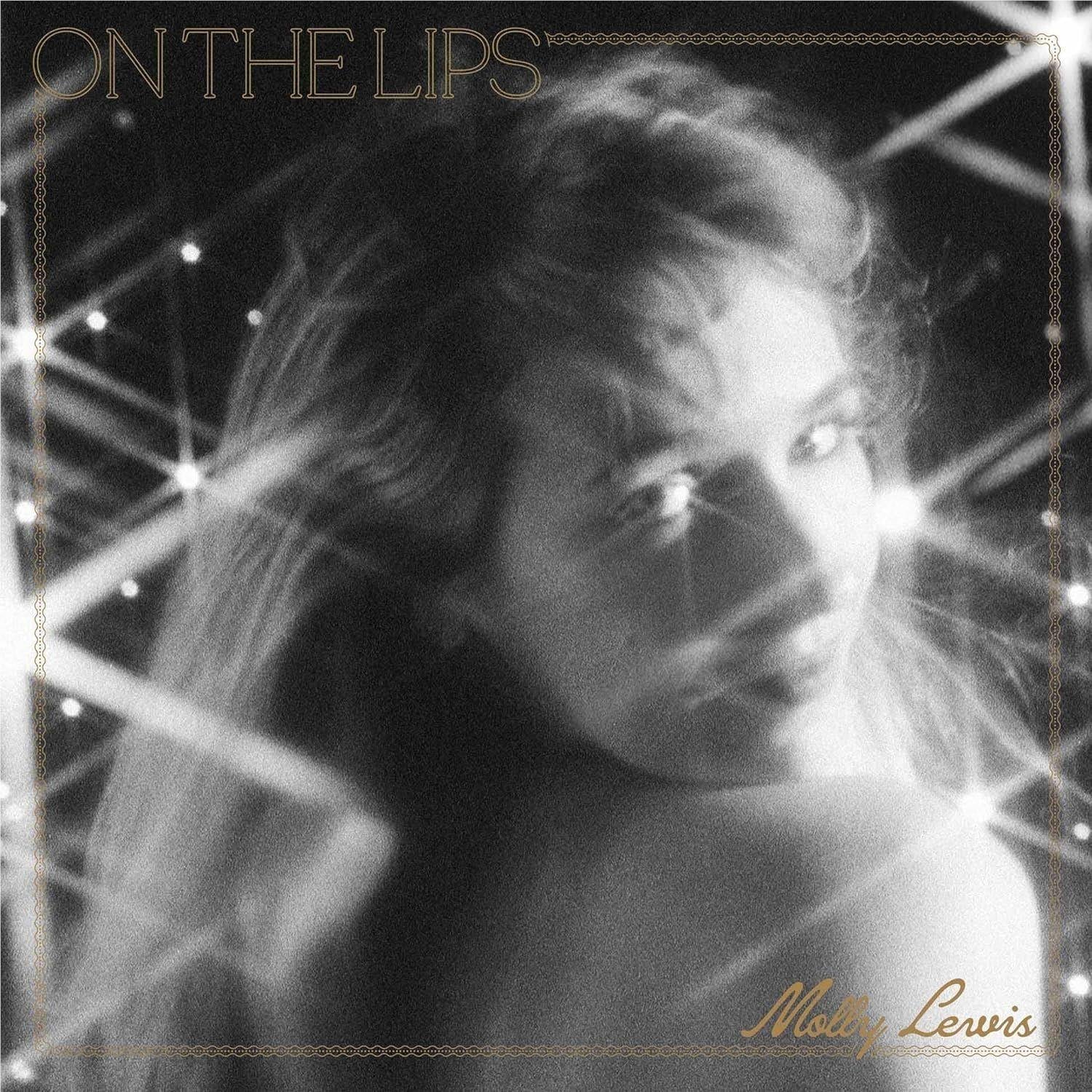 On The Lips cover art: black-and-white woman portrait with gold title text
