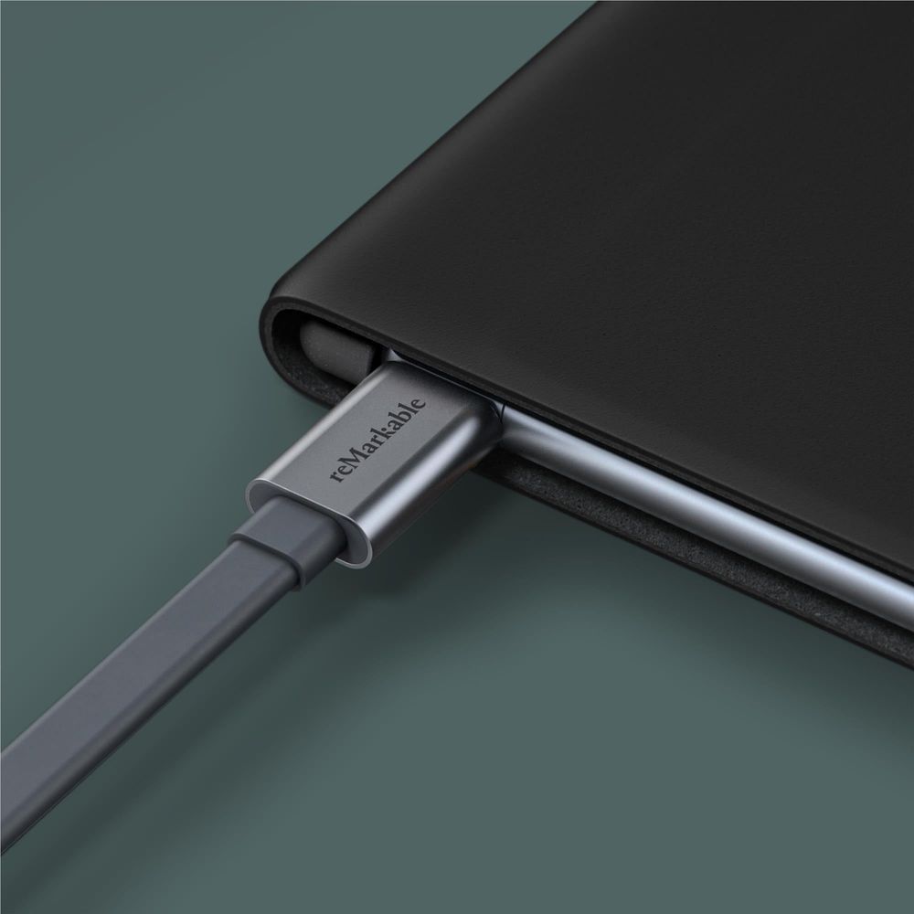 Black leather folio cover with side strap and device pocket for reMarkable 2