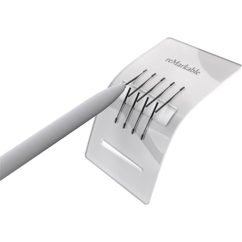reMarkable marker tip refill card with nine black tips, held at angle