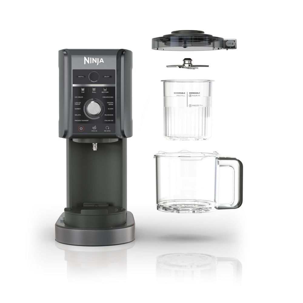 Ninja ice cream maker with clear pitcher, lid, and covered freezer container