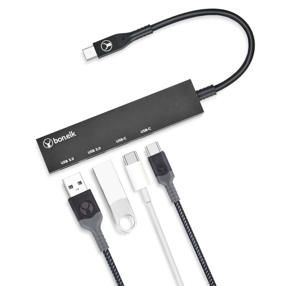 Black USB-C hub with braided cable and included USB adapters