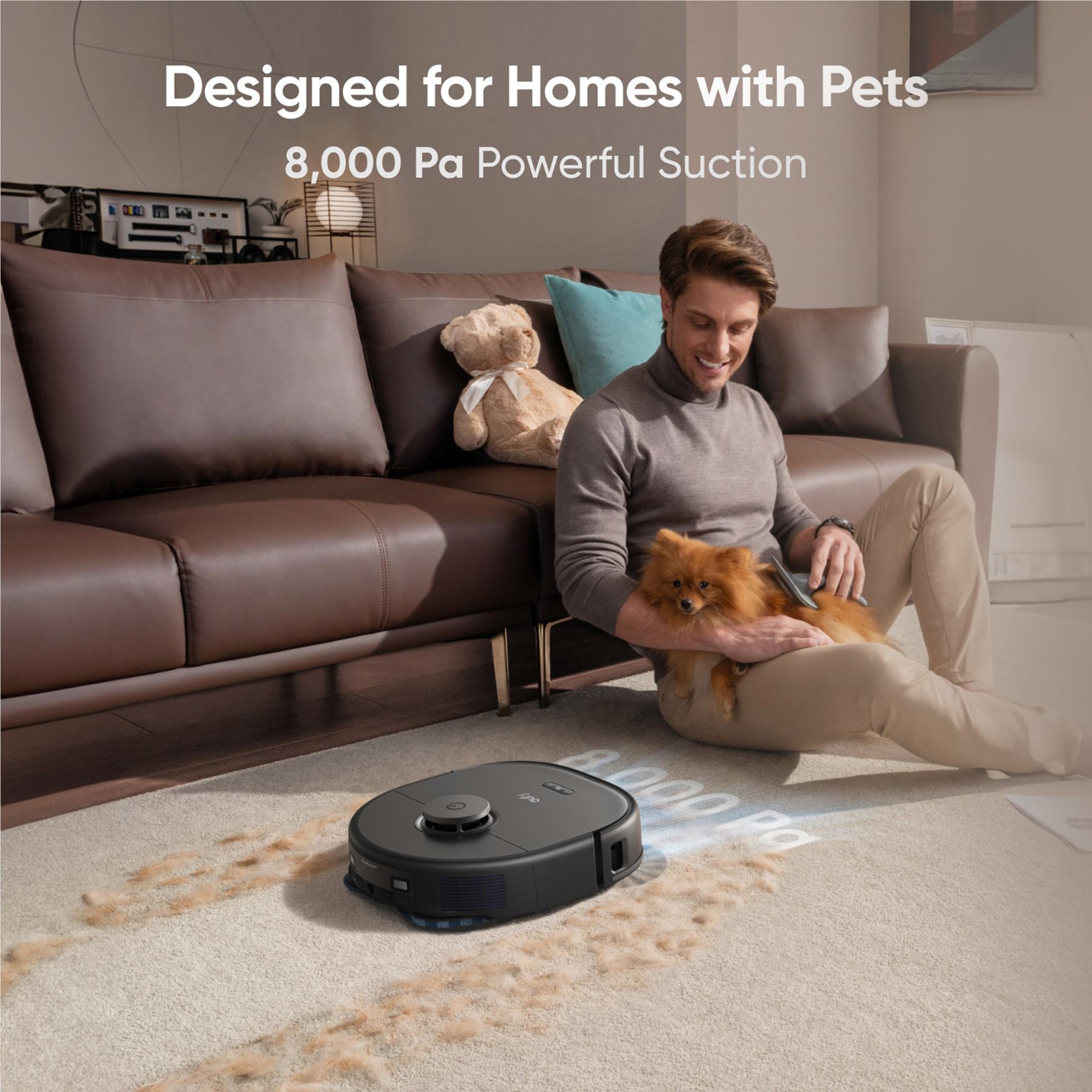 Black robot vacuum moving on a carpeted floor