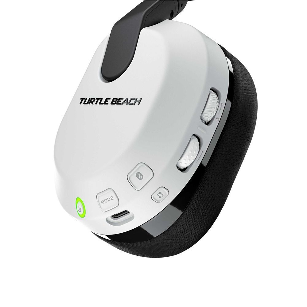 White earcup controls on a wireless gaming headset with black mesh-padded band
